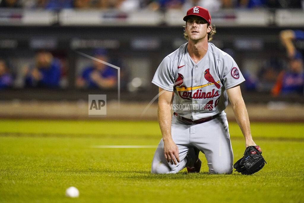 Frank Franklin Ii St. Louis Cardinals starting pitcher Jake Woodford reacts to an RBI bunt single by New York Mets' Javier Baez during the first inning of a baseball game Tuesday, Sept. 14, 2021, in New York. (AP Photo/Frank Franklin II)