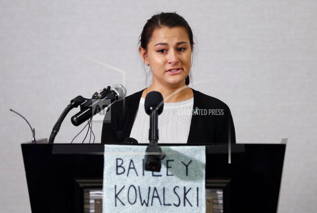 Paul Sancya Bailey Kowalski speaks during a news conference in East Lansing, Mich., Thursday, April 11, 2019. The 22-year-old Michigan State University student is speaking publicly a year after suing the school, alleging that three former men's basketball players raped her in 2015 and that she was discouraged by counseling center staff from reporting what happened. (AP Photo/Paul Sancya)