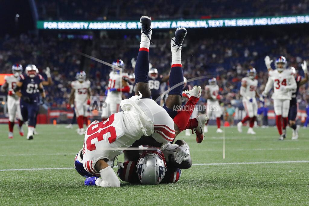 Michael Dwyer New England Patriots wide receiver Lil'Jordan Humphrey, below, arrives in the end zone for a touchdown as New York Giants cornerback Zyon Gilbert (38) defends during the second half of a preseason NFL football game, Thursday, Aug. 11, 2022, in Foxborough, Mass. (AP Photo/Michael Dwyer)