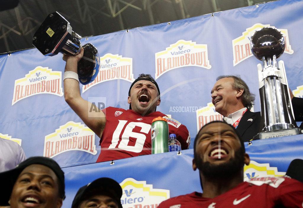 Eric Gay Washington State quarterback Gardner Minshew (16) holds his Offensive Player of the Game trophy as he celebrates the team's 28-26 win over Iowa State in the Alamo Bowl NCAA college football game, Friday, Dec. 28, 2018, in San Antonio. (AP Photo/Eric Gay)