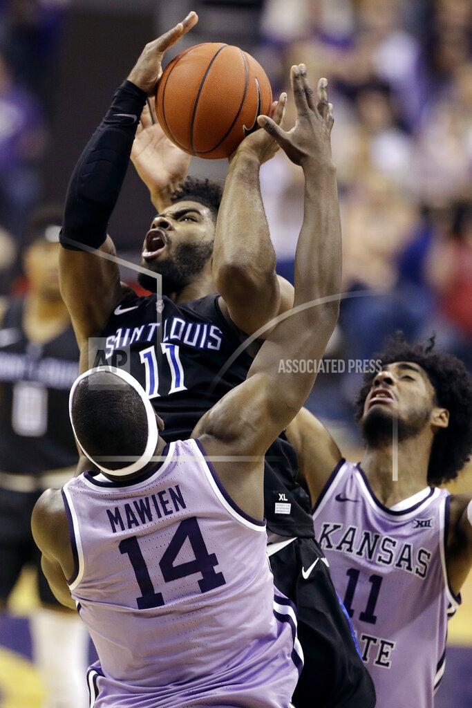 Charlie Riedel Saint Louis' Hasahn French, top, shoots under pressure from Kansas State's Makol Mawien (14) and Antonio Gordon, right, during the second half of an NCAA college basketball game Saturday, Dec. 21, 2019, in Kansas City, Mo. (AP Photo/Charlie Riedel)