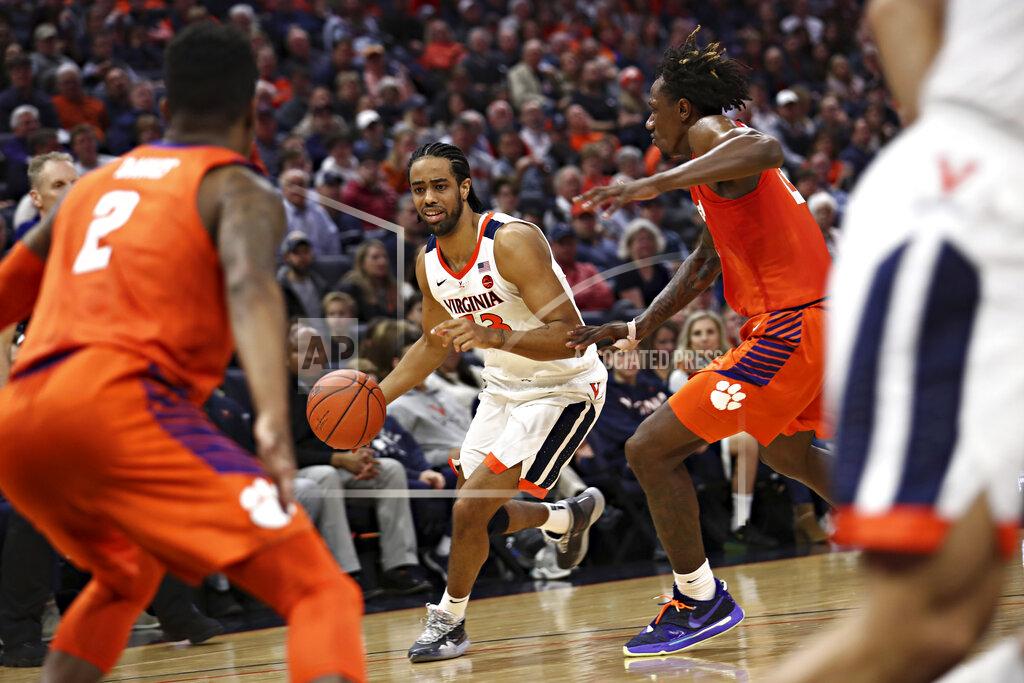 Erin Edgerton Virginia guard Tomas Woldetensae (53) dribbles the ball between Clemson defenders during an NCAA college basketball game Wednesday, Feb. 5, 2020, in Charlottesville, Va. (Erin Edgerton/The Daily Progress via AP)