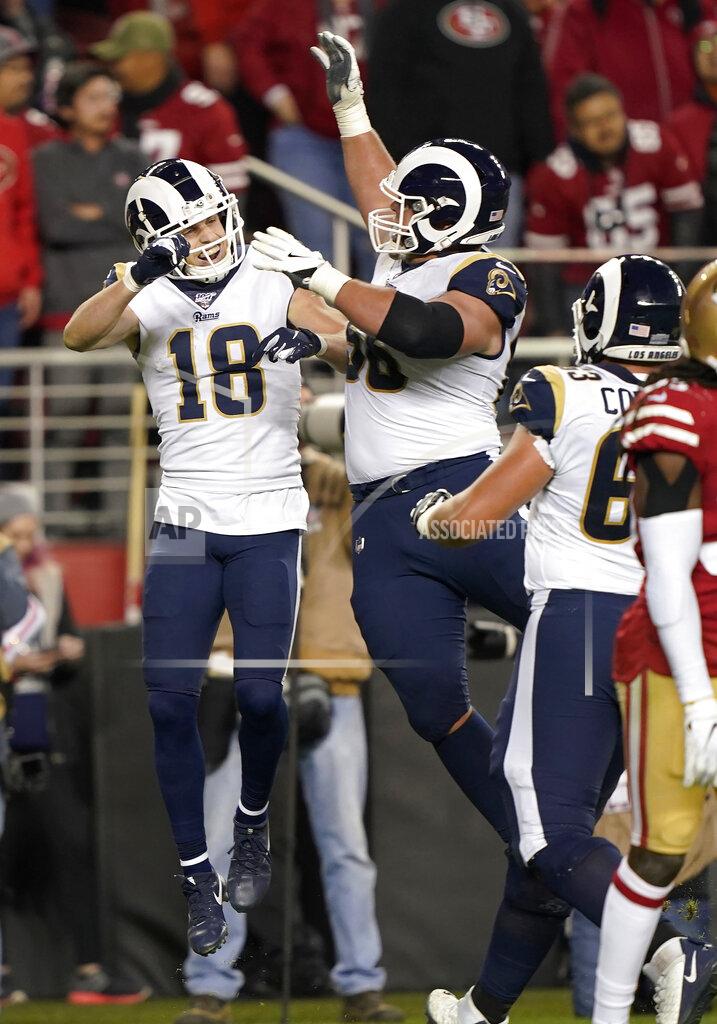 Tony Avelar Los Angeles Rams wide receiver Cooper Kupp (18) celebrates with Austin Blythe, center, and Austin Corbett after scoring against the San Francisco 49ers during the second half of an NFL football game in Santa Clara, Calif., Saturday, Dec. 21, 2019. (AP Photo/Tony Avelar)