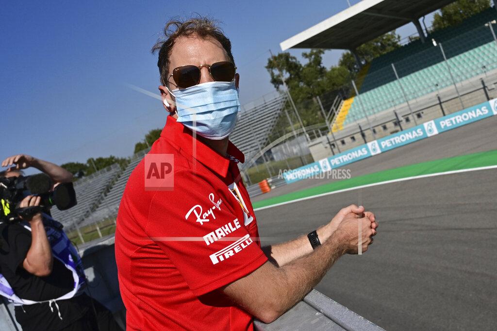 Miguel Medina Ferrari driver Sebastian Vettel of Germany watches the last moments of the qualifying session at the Monza racetrack in Monza, Italy, Saturday, Sept.5, 2020. The Italian Formula One Grand Prix will be held on Sunday. (Miguel Medina, Pool via AP)