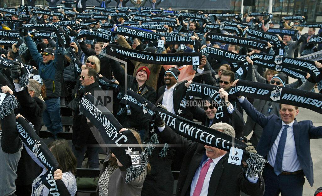 Jim Mone In this March 18, 2019, photo, soccer supporters wave scarves as Minnesota United FC Loons held a scarf raising ceremony in advance of the MLS soccer team's home opener April 13 against New York City FC in the new Allianz Field stadium in St. Paul, Minn. (AP Photo/Jim Mone)