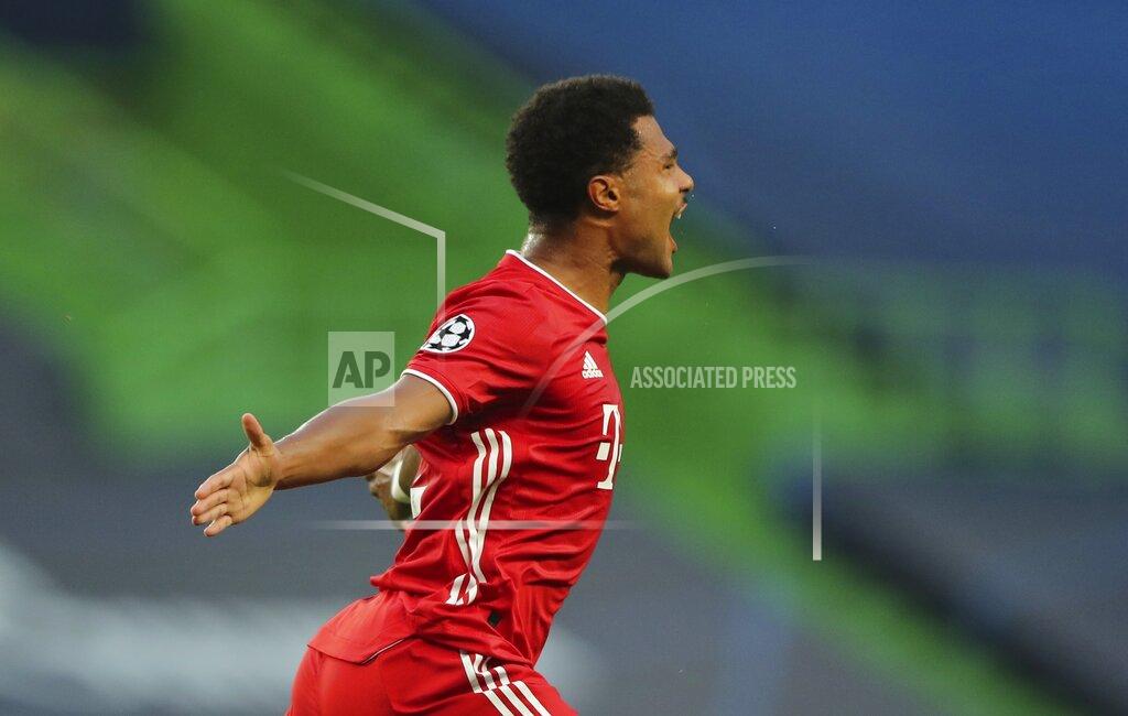 Miguel A. Lopes Bayern's Serge Gnabry celebrates after scoring the opening goal of his team during the Champions League semifinal soccer match between Lyon and Bayern Munich at the Jose Alvalade stadium in Lisbon, Portugal, Wednesday, Aug. 19, 2020. (Miguel A. Lopes/Pool via AP)