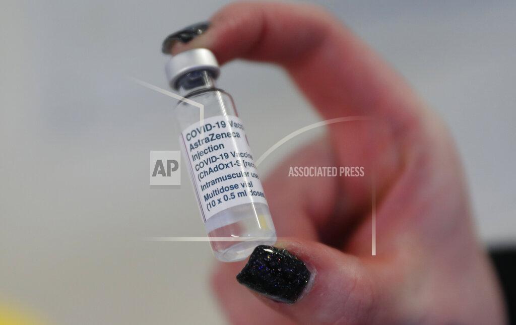 Alastair Grant A vial of the AstraZeneca COVID-19 vaccine ready for use at the Wheatfield surgery in Luton, England, Thursday, March 18, 2021. (AP Photo/Alastair Grant)