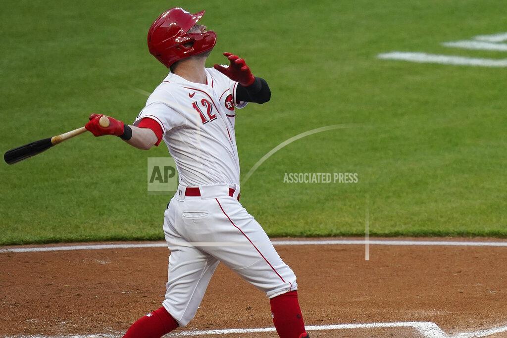 Bryan Woolston Cincinnati Reds' Tyler Naquin follows through on a home run during the third inning of the team's baseball game against the Pittsburgh Pirates at Great American Ball Park in Cincinnati, Tuesday, April 6, 2021. (AP Photo/Bryan Woolston)