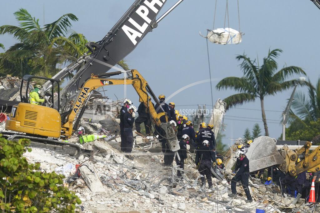 Lynne Sladky FILE - Rescue crews work at the site of the collapsed Champlain Towers South condo building after the remaining structure was demolished Sunday, in Surfside, Fla., Monday, July 5, 2021. Attorneys for the families who lost relatives or homes in last year’s collapse of a Florida condominium tower that killed 98 people finalized a $1 billion settlement on Friday, May 27, 2022. (AP Photo/Lynne Sladky, File)