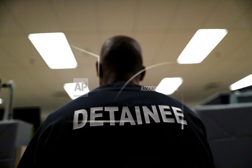 Gregory Bull A detainee sits at the Otay Mesa Detention Center Wednesday, Aug. 23, 2017, in San Diego. The facility was at the center of the first big novel coronavirus outbreak at a U.S. immigration detention center in April 2020. (AP Photo/Gregory Bull)