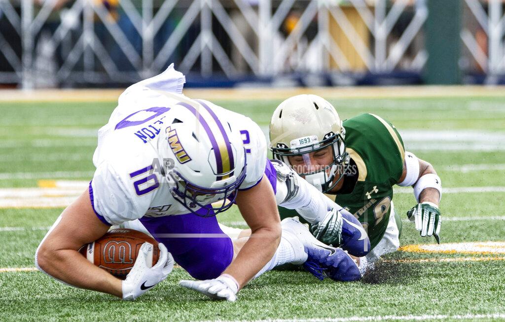Mike Caudill William & Mary's Latrelle Smith (28) brings down James Madison's Riley Stapleton (10) during the first half of an NCAA college football game in Williamsburg, Va., on Saturday, Oct. 19, 2019. (Mike Caudill/The Virginian-Pilot via AP)