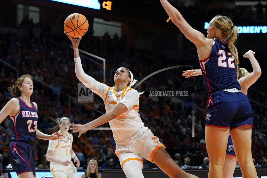 Mark Humphrey Tennessee's Rae Burrell, center, puts up a shot between Belmont's Nikki Baird (23) and Tessa Miller (22) in the second half of a women's college basketball game in the second round of the NCAA tournament Monday, March 21, 2022, in Knoxville, Tenn. Tennessee won 70-67. (AP Photo/Mark Humphrey)