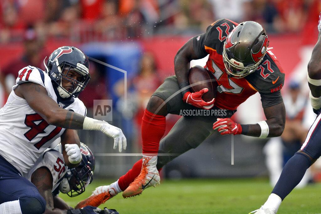 Jason Behnken Tampa Bay Buccaneers running back Ronald Jones II (27) gets by Houston Texans inside linebacker Zach Cunningham (41) on a 4-yard score during the first half of an NFL football game Saturday, Dec. 21, 2019, in Tampa, Fla. (AP Photo/Jason Behnken)