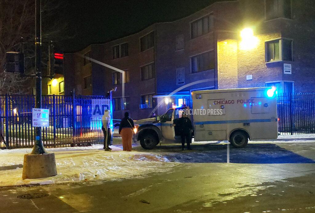 Emergency responders work the scene of a shooting late Friday, Feb. 14, 2020 in Chicago. Six people, including three minors, were wounded in a shooting at an apartment complex on Chicago's South Side, police said.
The Friday night shooting started during a “gathering” inside an apartment unit and spilled into the hall, police said in a release early Saturday. (Nader Issa/Chicago Sun-Times via AP)