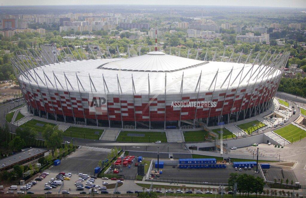FILE - This Friday, May 18, 2012 file photo aerial view, made from an hot air balloon, shows the National Stadium, in Warsaw, Poland. Poland’s government is transforming the National Stadium in Warsaw into a field hospital to handle the surging number of patients infecting with the coronavirus. A government spokesman said Monday, Oct. 19, 2020 that the stadium will have room for 500 patients and will be equipped with oxygen therapy for those who need it. (AP Photo/Czarek Sokolowski, File)