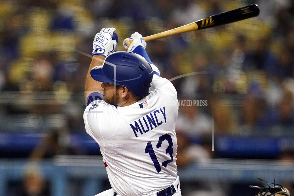 Marcio Jose Sanchez Los Angeles Dodgers' Max Muncy follows through on a double during the first inning of a baseball game against the Arizona Diamondbacks Tuesday, Sept. 14, 2021, in Los Angeles. (AP Photo/Marcio Jose Sanchez)