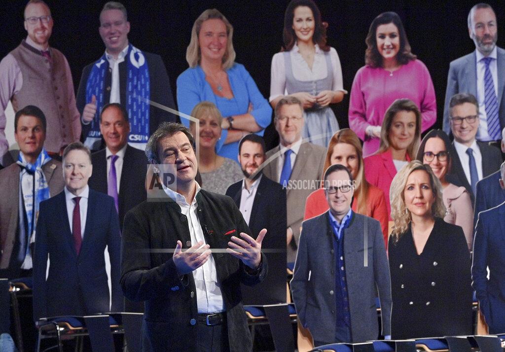 Peter Kneffel File - In this Wednesday, Feb.17, 2021 file photo, Bavarian Prime Minister Markus Soeder (CSU) speaks at the party's Political Ash Wednesday in front of cardboard audience in Passau, Germany. Markus Soeder is many things: state governor of Bavaria, Star Trek fan, a conservative for whom combating climate change is an article of faith. The question Germans are asking now is: can the 54-year-old win enough backing across the political spectrum to succeed Angela Merkel as chancellor in September. (Peter Kneffel/Pool via AP, file)