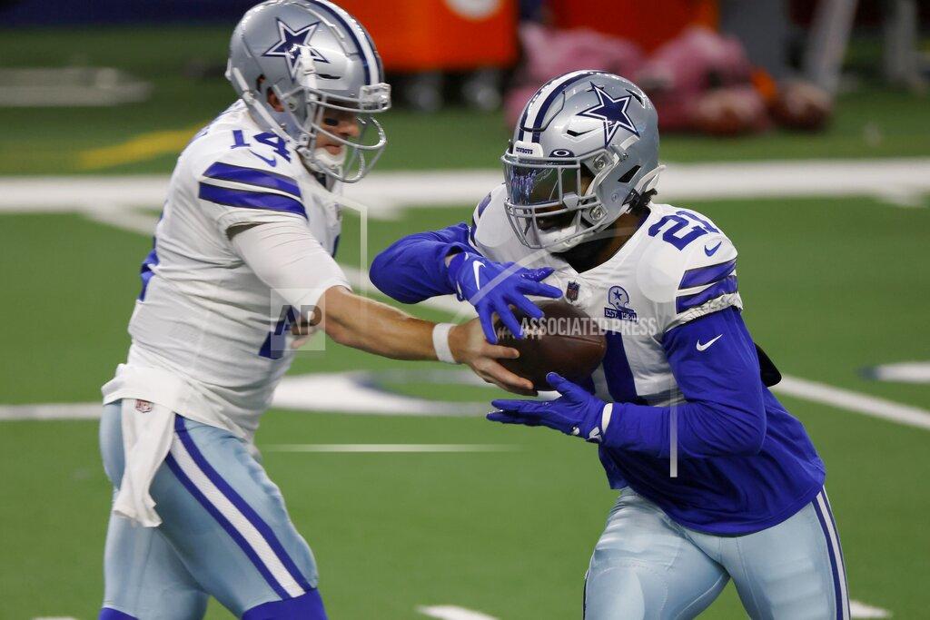 Ron Jenkins Dallas Cowboys' Andy Dalton hands the ball off to Ezekiel Elliott (21) during warmups before an NFL football game against the Arizona Cardinals in Arlington, Texas, Monday, Oct. 19, 2020. (AP Photo/Ron Jenkins)