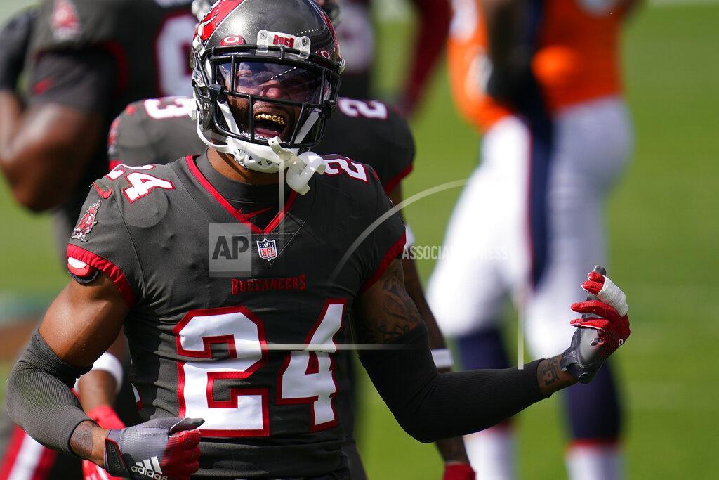 David Zalubowski Tampa Bay Buccaneers cornerback Carlton Davis reacts after hauling down Denver Broncos wide receiver K.J. Hamler during the first half of an NFL football game Sunday, Sept. 27, 2020, in Denver. (AP Photo/David Zalubowski)