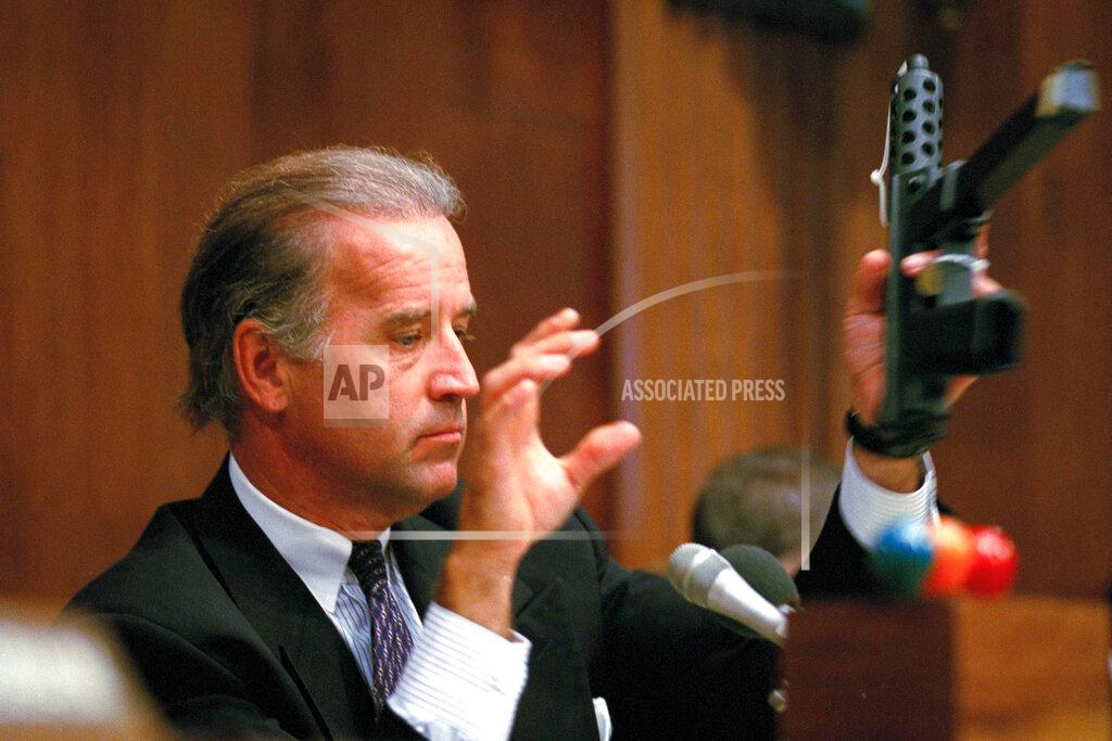 Barry Thumma FILE - Sen. Joe Biden, D-Del., chairman of the Senate Judiciary Committee, holds a TEC-9 semi-automatic weapon during a hearing of the committee on Capitol Hill, Aug. 3, 1993, as the committee holds hearings on combating the proliferation of assault weapons. A collection of black, military-style rifles were laid out in the middle of the room as Biden, then the chairman of the Senate Judiciary Committee, denounced the sale of guns whose “only real function is to kill human beings at a ferocious pace.” (AP Photo/Barry Thumma, File)
