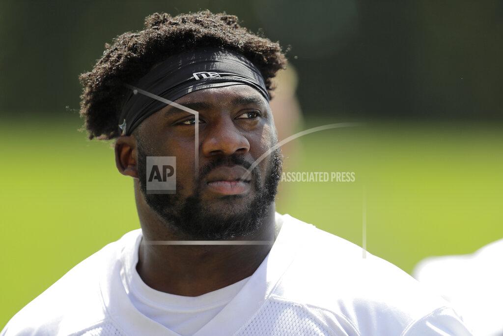 Ted S. Warren FILE - In this June 4, 2019, file photo, Seattle Seahawks defensive end L.J. Collier walks off the field after an organized team activity at the team's NFL football training facility in Renton, Wash. Collier has been out for weeks, DK Metcalf just underwent surgery and Marquise Blair has a sore back. The Seahawks still have high hopes for their draft class but many aren't even on the field currently. (AP Photo/Ted S. Warren, File)