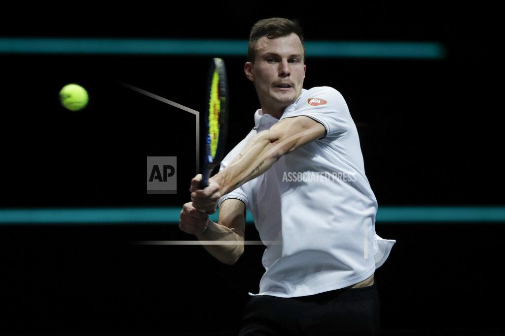 Peter Dejong Hungary's Marton Fucsovics plays a shot against Russia's Andrey Rublev in the final men's singles match of the ABN AMRO world tennis tournament at Ahoy Arena in Rotterdam, Netherlands, Sunday, March 7, 2021. (AP Photo/Peter Dejong)