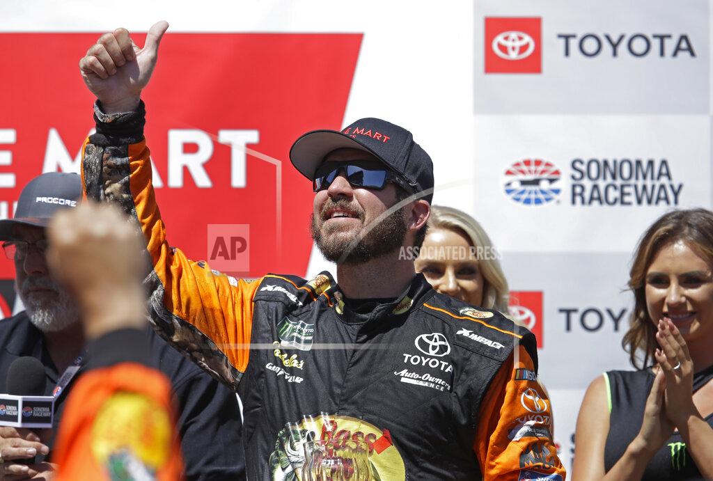 Ben Margot Martin Truex Jr. celebrates after winning a NASCAR Sprint Cup Series auto race Sunday, June 23, 2019, in Sonoma, Calif. (AP Photo/Ben Margot)