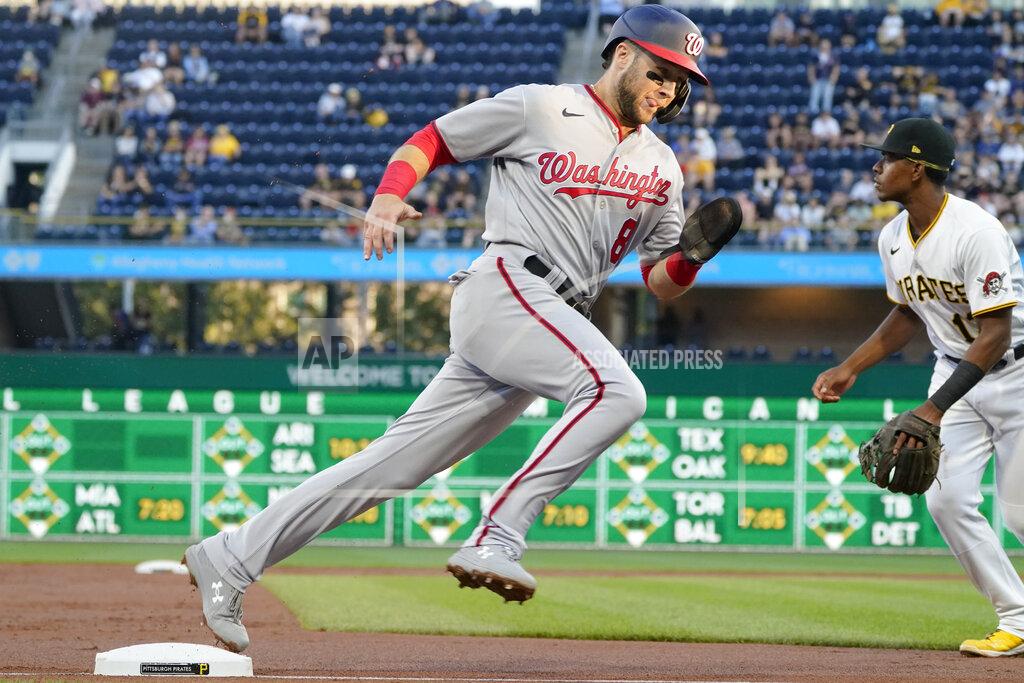 Keith Srakocic Washington Nationals' Carter Kieboom dashes around third and Pittsburgh Pirates third baseman Ke'Bryan Hayes on his way to score on a triple by Riley Adams during the second inning of a baseball game Friday, Sept. 10, 2021, in Pittsburgh. (AP Photo/Keith Srakocic)