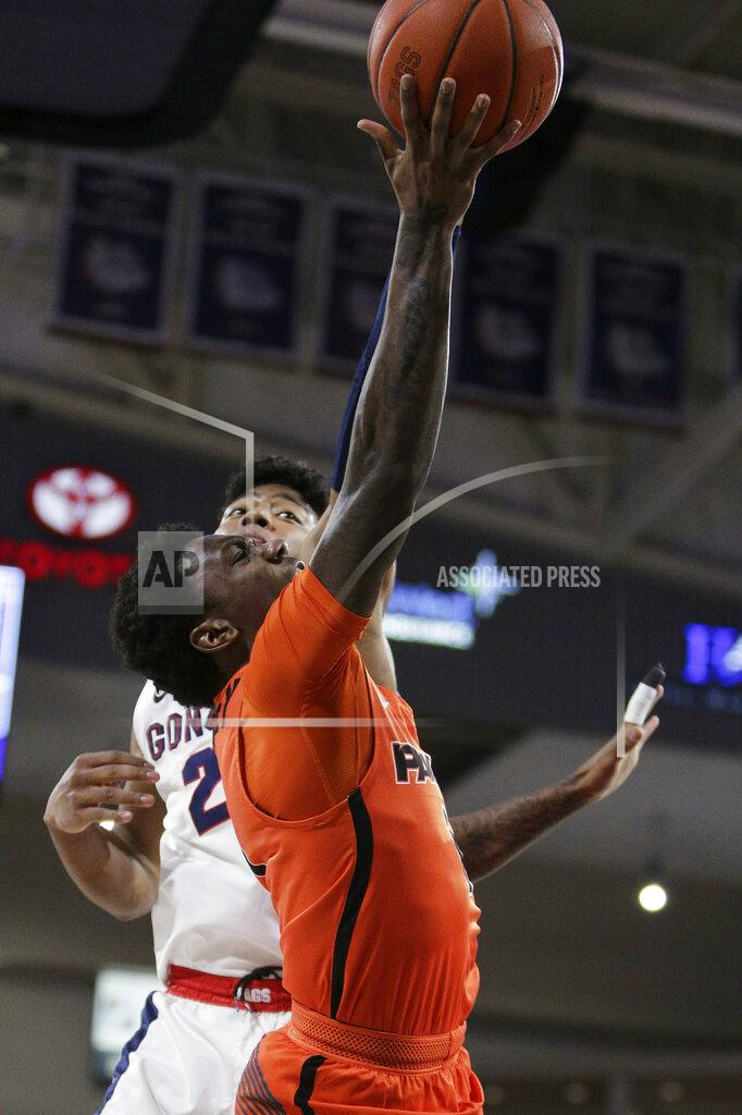Young Kwak Pacific guard Lafayette Dorsey, front, shoots and is fouled by Gonzaga forward Rui Hachimura (21) during the first half of an NCAA college basketball game in Spokane, Wash., Thursday, Jan. 10, 2019. (AP Photo/Young Kwak)