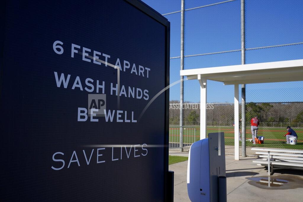 Brynn Anderson Signs are posted during a Boston Red Sox spring training baseball practice on Monday, Feb. 22, 2021, in Fort Myers, Fla. (AP Photo/Brynn Anderson)