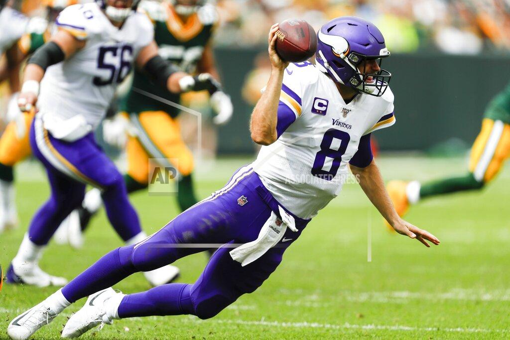 Matt Ludtke Minnesota Vikings' Kirk Cousins throws as he falls during the second half of an NFL football game against the Green Bay Packers Sunday, Sept. 15, 2019, in Green Bay, Wis. (AP Photo/Matt Ludtke)