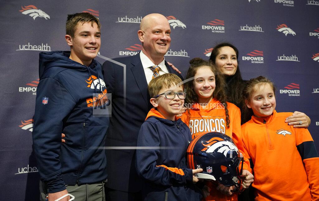 David Zalubowski New Broncos head coach Nathaniel Hackett, second from left in back, poses for a photograph with his family after a news conference to introduce him as the team's new NFL head football coach Friday, Jan. 28, 2022, in Englewood, Colo. Hackett's children are, Harrison, 13, back left, London, 11, front left, Briar, 12, front center, and Everly, 9. His wife, Megan, is back right. (AP Photo/David Zalubowski)