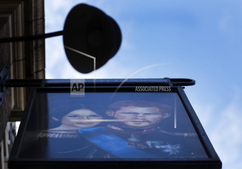 Frank Augstein A sign depicting the image of Britain's Prince Harry and his wife Meghan, hangs outside the Duke of Sussex pub near Waterloo station, London, Tuesday March 9, 2021. Prince Harry and Meghan's explosive TV interview has divided people around the world, rocking an institution that is struggling to modernize with claims of racism and callousness toward a woman struggling with suicidal thoughts. (AP Photo/Frank Augstein)