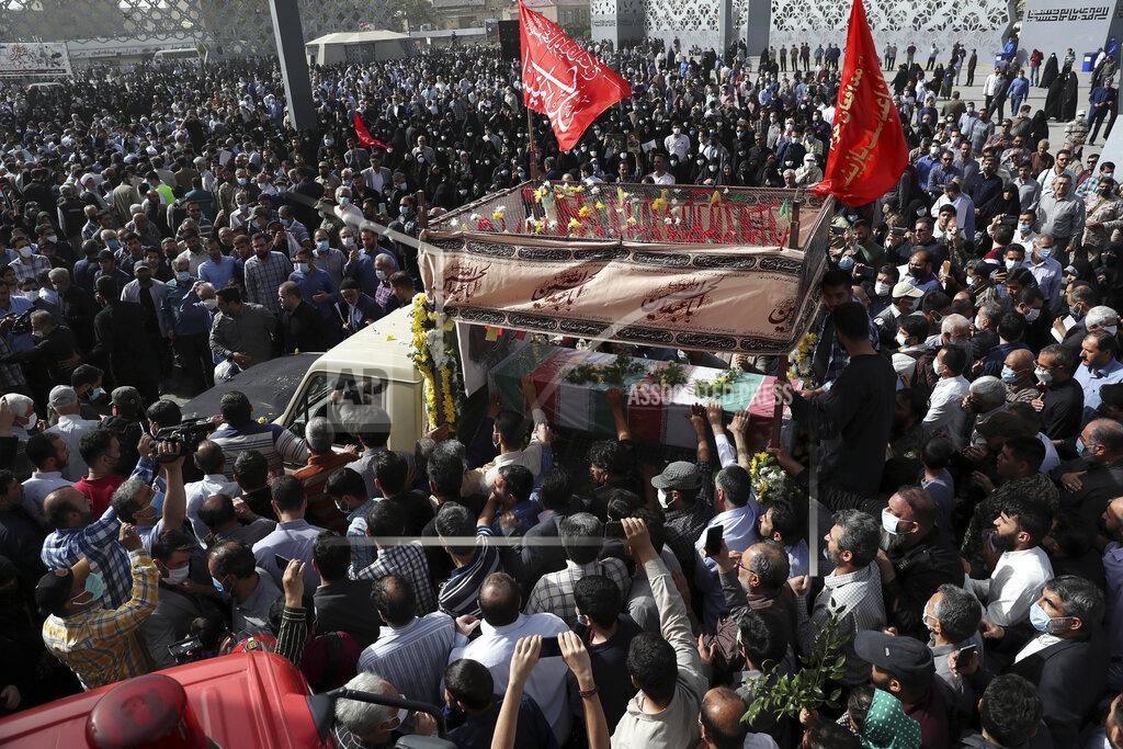 Vahid Salemi Mourners gather around a truck carrying the flag draped coffin of Iran's Revolutionary Guard Col. Hassan Sayyad Khodaei who was killed on Sunday, in his funeral ceremony in Tehran, Iran, Tuesday, May 24, 2022. Iran's hard-line President Ebrahim Raisi vowed revenge on Monday over the killing of Sayyad Khodaei who was shot at his car by two assailants outside his home in Tehran, a still-mysterious attack on the country's powerful paramilitary force. (AP Photo/Vahid Salemi)