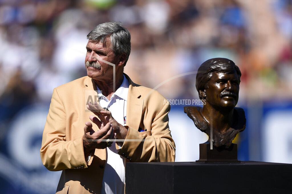 Kelvin Kuo FILE - In this Sept. 18, 2016, file photo, former Rams team member Tom Mack stands with his bust during the Rams Hall of Fame Ring of Excellence ceremony at halftime of an NFL football game between the Los Angeles Rams and the Seattle Seahawks, in Los Angeles. As the NFL gears up for a yearlong celebration of its history for its 100th season, some of the stars who helped build the league into the behemoth it has become want to make sure the old-timers are no longer left behind. (AP Photo/Kelvin Kuo, File)
