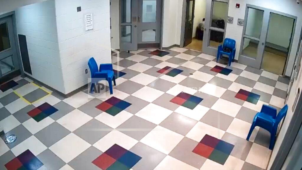 Uncredited In this image from surveillance video provided by Sedgwick County, staff members restrain Cedric “C.J.” Lofton, 17, at the Sedgwick County Juvenile Intake and Assessment Center in Wichita, Kan., on Sept. 24, 2021. The final autopsy, released in December, listed C.J.'s cause of death as “complications of cardiopulmonary arrest sustained after physical struggle while restrained in the prone position.” The death was declared a homicide. (Sedgwick County via AP)