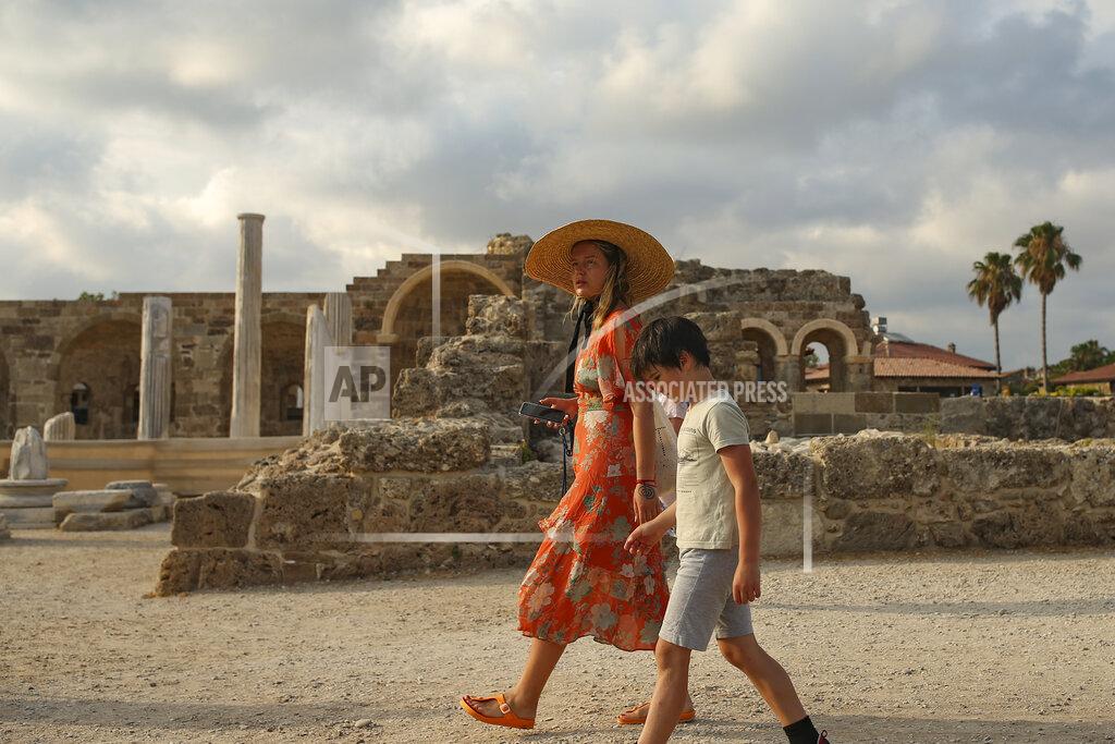 Emrah Gurel Tourists visit the ancient site of Antalya, southern Turkey, on Sunday, June 20, 2021. Hotels in Turkey's Antalya region, a destination beloved by holidaymakers, are preparing to finally resume operations as they expect the return of international tourists after months of setbacks caused by the pandemic that halted travel. (AP Photo/Emrah Gurel)