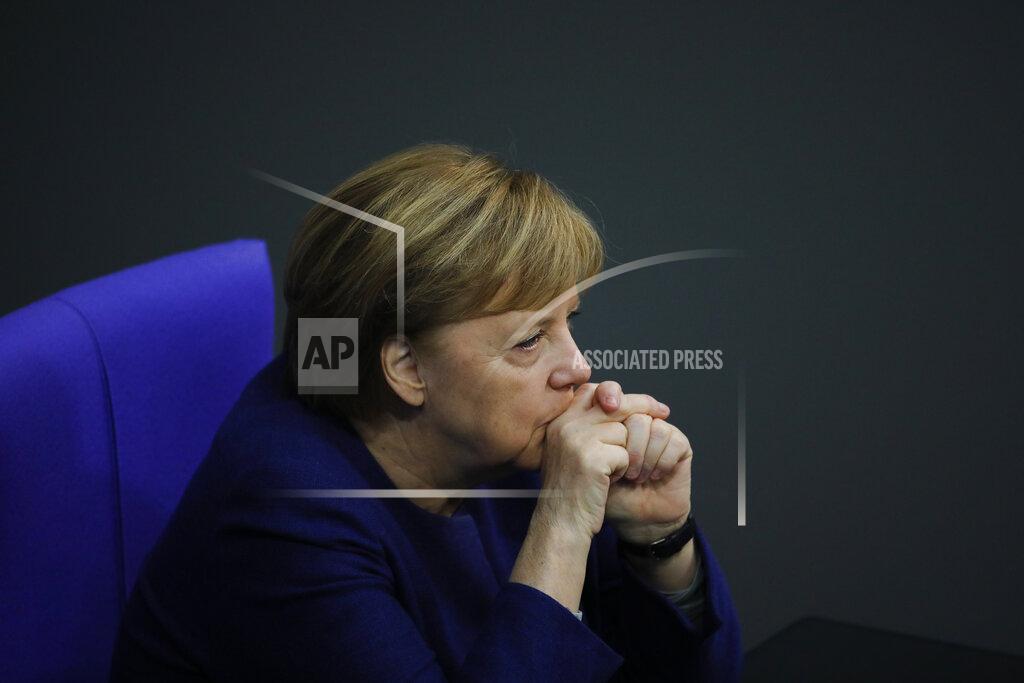 Markus Schreiber File - In this Tuesday, Dec. 8, 2020 file photo, German Chancellor Angela Merkel attends the debate about Germany's budget 2021, at the parliament Bundestag in Berlin, Germany. German Chancellor Angela Merkel's center-right party, the Christian Democratic Union, CDU, is choosing a new leader on the weekend Saturday Jan. 16 and Sunday Jan. 17, 2021, a decision that will help determine who succeeds Merkel at the helm of the European Union's biggest economy after a 16-year reign. Merkel, now 66, has steered Germany, and Europe, through a series of crises since she took office in 2005, she said over two years ago that she won't seek a fifth term as chancellor. (AP Photo/Markus Schreiber, file)