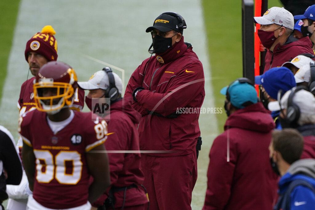 Susan Walsh Washington Football Team head coach Ron Rivera, center, on the sidelines during the first half of an NFL football game against Dallas Cowboys, Sunday, Oct. 25, 2020, in Landover, Md. (AP Photo/Susan Walsh)