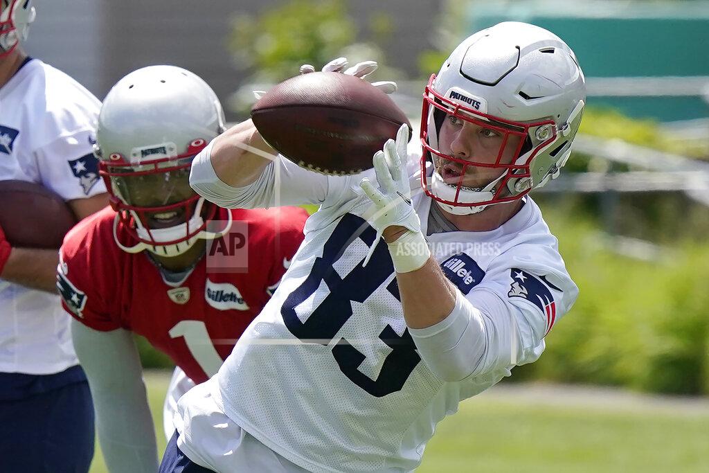 Steven Senne New England Patriots tight end Matt LaCosse (83) makes a catch as quarterback Cam Newton (1) looks on during NFL football practice in Foxborough, Mass., Thursday, May 27, 2021. (AP Photo/Steven Senne)