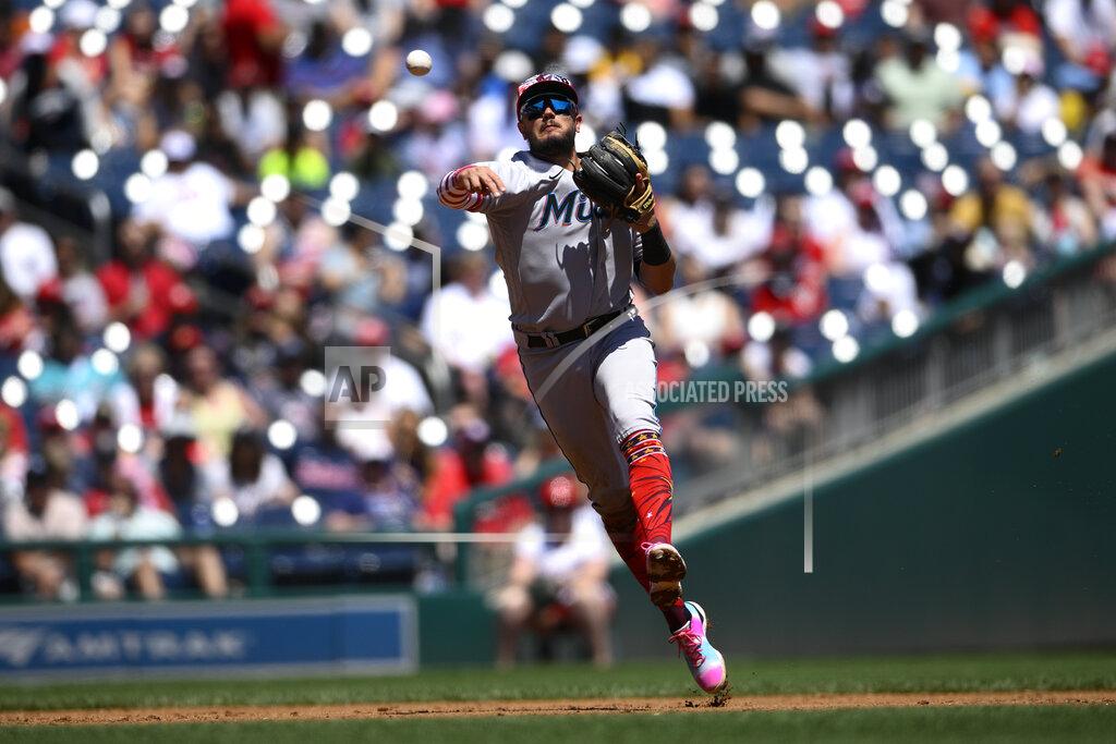 Nick Wass Miami Marlins shortstop Miguel Rojas throws to first to put out Washington Nationals' Lane Thomas during the third inning of a baseball game, Monday, July 4, 2022, in Washington. (AP Photo/Nick Wass)