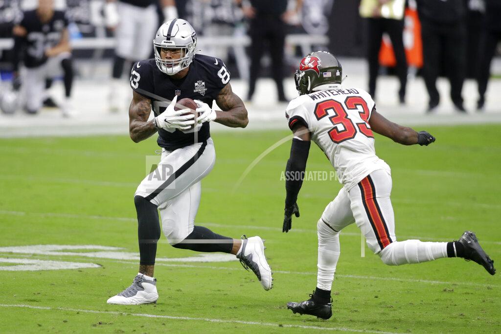 Isaac Brekken Las Vegas Raiders tight end Darren Waller (83) runs against Tampa Bay Buccaneers free safety Jordan Whitehead (33) during the first half of an NFL football game, Sunday, Oct. 25, 2020, in Las Vegas. (AP Photo/Isaac Brekken)