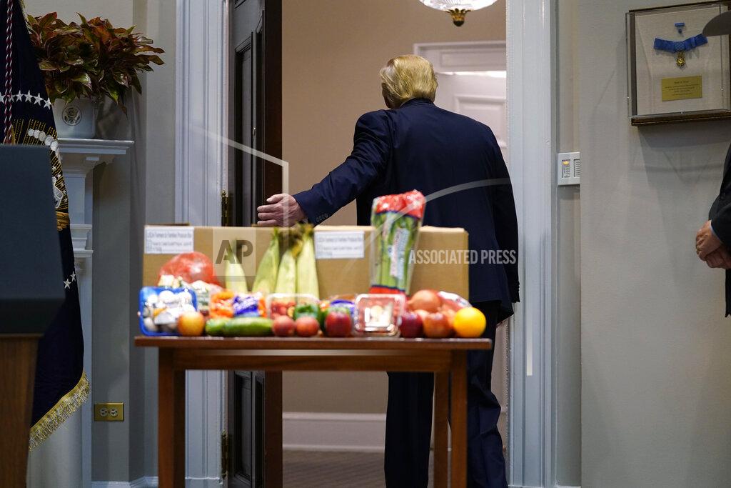 Evan Vucci President Donald Trump leaves after an event on the food supply chain during the coronavirus pandemic, in the Roosevelt Room of the White House, Tuesday, May 19, 2020, in Washington. (AP Photo/Evan Vucci)
