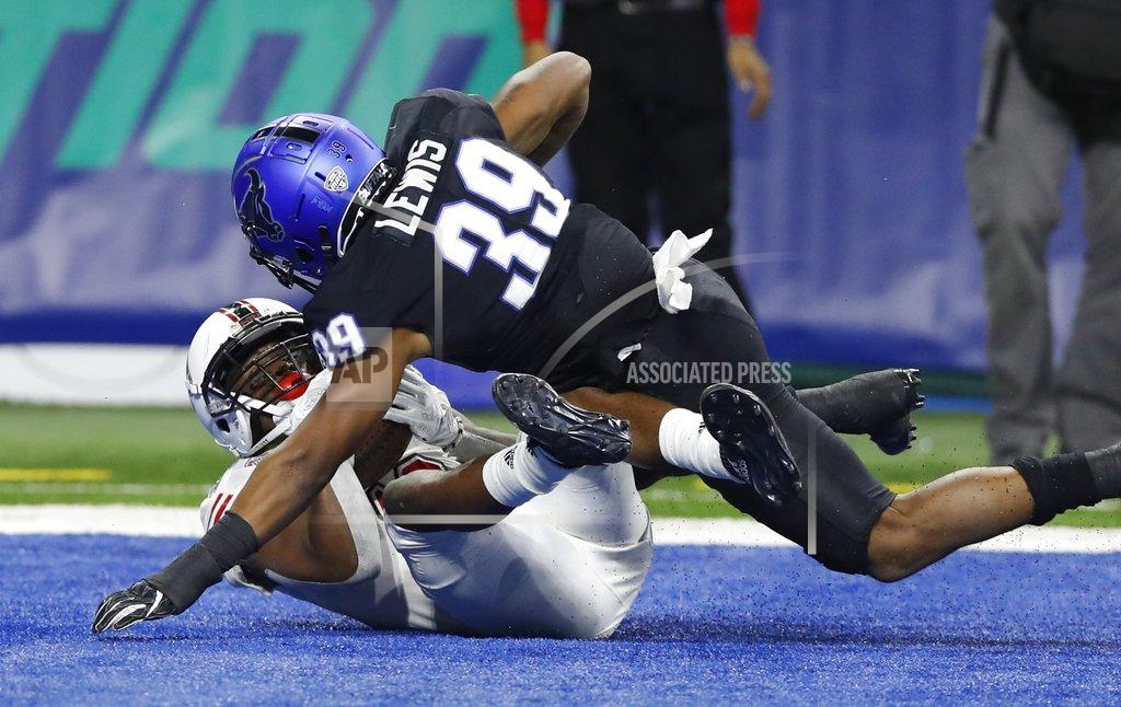 Carlos Osorio Northern Illinois wide receiver D.J. Brown, defended by Buffalo cornerback Cameron Lewis (39), falls into the end zone after catching a 8-yard pass for the go-ahead touchdown during the second half of the Mid-American Conference championship NCAA college football game, Friday, Nov. 30, 2018, in Detroit. (AP Photo/Carlos Osorio)