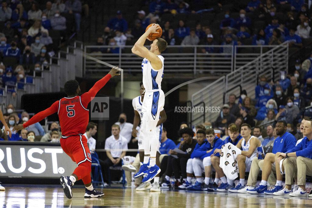 Rebecca S. Gratz Creighton's Alex O'Connell (5) shoots a three-pointer against St. John's Dylan Addae-Wusu (5) during the second half of an NCAA college basketball game Wednesday, Jan. 19, 2022, in Omaha, Neb. O'Connell scored 28 points during the game, including 6 three point baskets. Creighton defeated St. John's 87-64. (AP Photo/Rebecca S. Gratz)