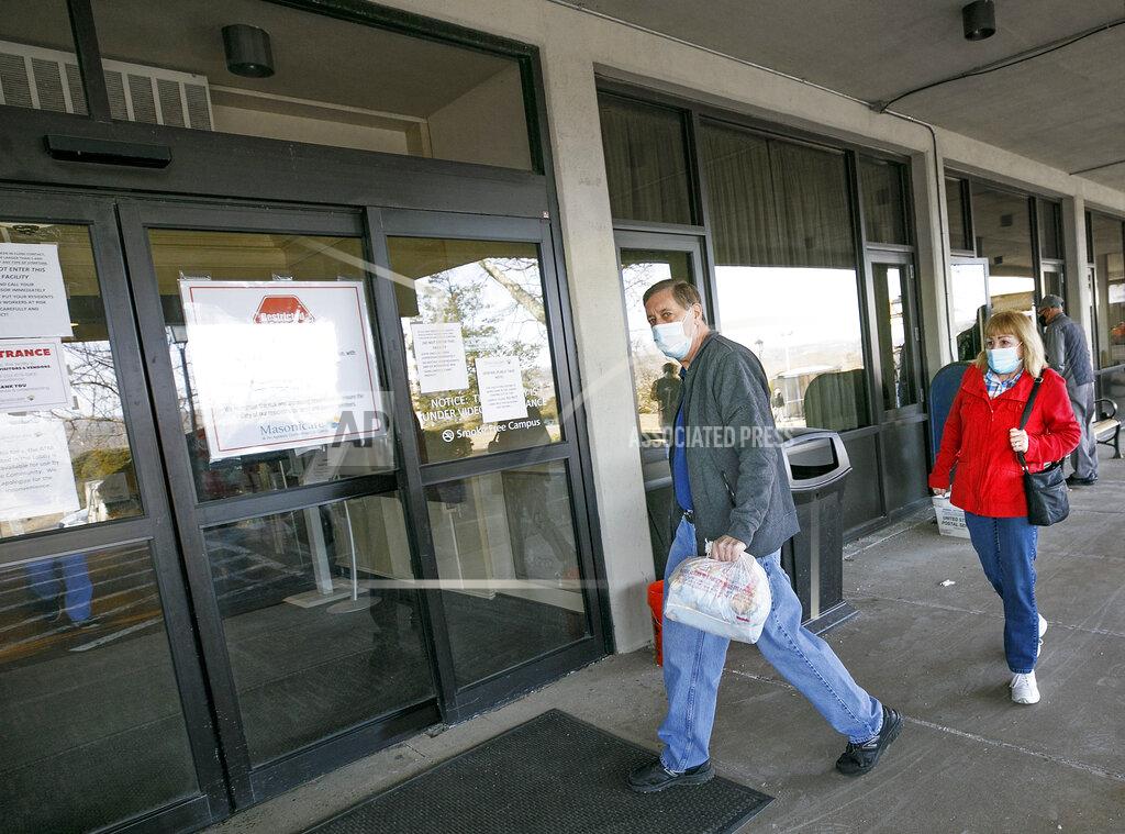 Dave Zajac Robert Post, of Wallingford, enters Masonicare Health Center with wife Eileen to visit his mother Pearl Post, 87, at the assisted living community in Wallingford, Wednesday, March 10, 2021. Masonicare Health Center opened to visitors Wednesday afternoon. (Dave Zajac/Record-Journal via AP)