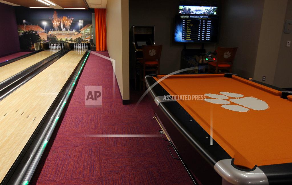 Ken Ruinard This Jan. 31, 2017 photo, shows a bowling alley and pool table inside the Clemson Football Facility at Clemson University in Clemson, S.C. When it comes to facilities in the ACC, Clemson has set the standard. The Tigers opened a $55 million team headquarters two years ago that includes a miniature golf course, a slide and a nap room. With the team pursuing its fourth straight ACC title and College Football Playoff berth, they feel the investment is paying off. (Ken Ruinard/The Independent-Mail via AP)