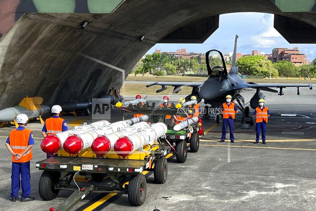 Johnson Lai Military personnel stand next to U.S. Harpoon A-84, anti-ship missiles and AIM-120 and AIM-9 air-to-air missiles prepared for a weapon loading drills in front of a U.S. F-16V fighter jet at the Hualien Airbase in Taiwan's southeastern Hualien county, Aug. 17, 2022. The intense firefight over Ukraine has the Pentagon rethinking its weapons stockpiles. If another major war broke out today, would the U.S. have enough ammunition to fight? It’s a question Pentagon planners are grappling with not only as the look to supply Ukraine for a war that could stretch for years, but also as they look to a potential conflict with China. (AP Photo/Johnson Lai, File)