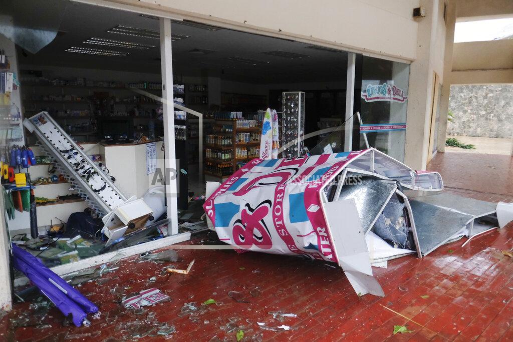 Victor Ruiz Garcia A storefront stands shattered by Hurricane Delta in Cancun, Mexico, Wednesday, Oct. 7, 2020. Hurricane Delta made landfall Wednesday just south of the Mexican resort of Cancun as a Category 2 storm, downing trees and knocking out power to some resorts along the northeastern coast of the Yucatan Peninsula. (AP Photo/Victor Ruiz Garcia)