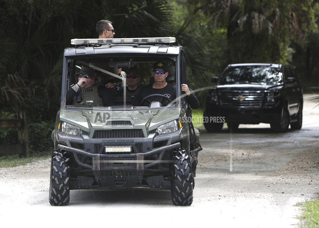 Matt Houston Law enforcement officers enter the T. Mabry Carlton Reserve in North Port, Fla., as they search for Brian Laundrie, Saturday, Sept. 18, 2021. Laundrie was traveling on a cross-country road trip with Gabby Petito, 22, who went missing in August. Petito's body was apparently discovered over the weekend at Grand Teton National Park. (Matt Houston/Sarasota Herald-Tribune via AP)